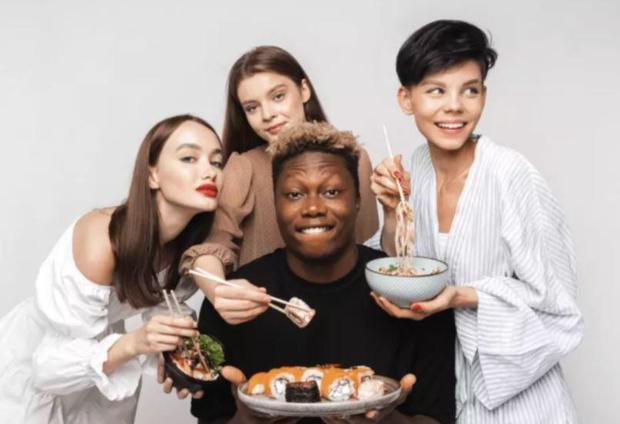 Russian Restaurant Chain Takes Down Ad With Black Man Surrounded By Slavic White Woman After Uproar